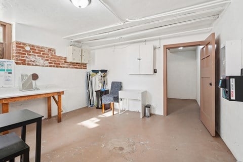 A room with a brick wall and a white ceiling.